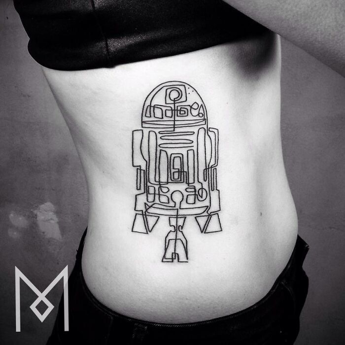 Single line tattoo of R2-D2 on a person's side, showcasing minimalist artistry.