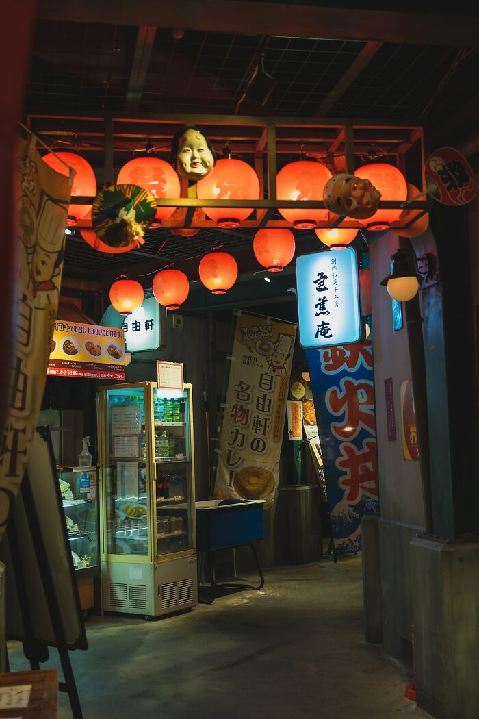 Japanese street food stall with red lanterns, cultural experience to have once in life, showcasing authentic décor.