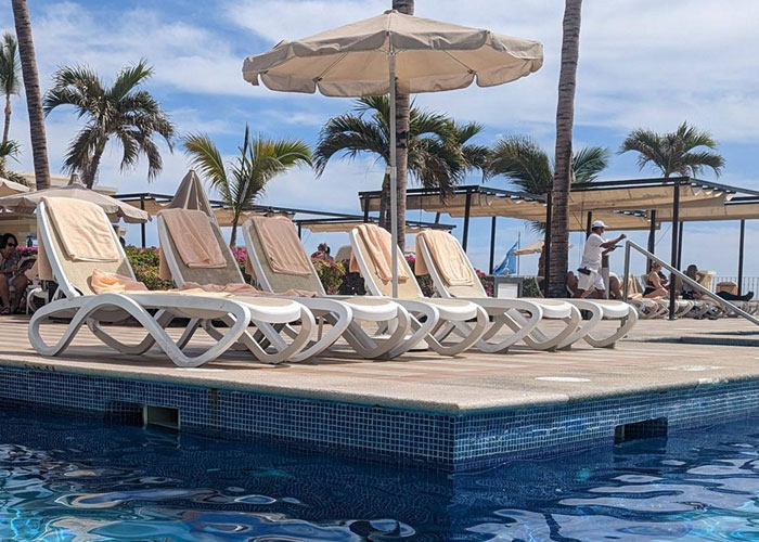 Woman Watches Chaos Ensue After Taking Towels Off Every Lounge Chair In Petty Revenge