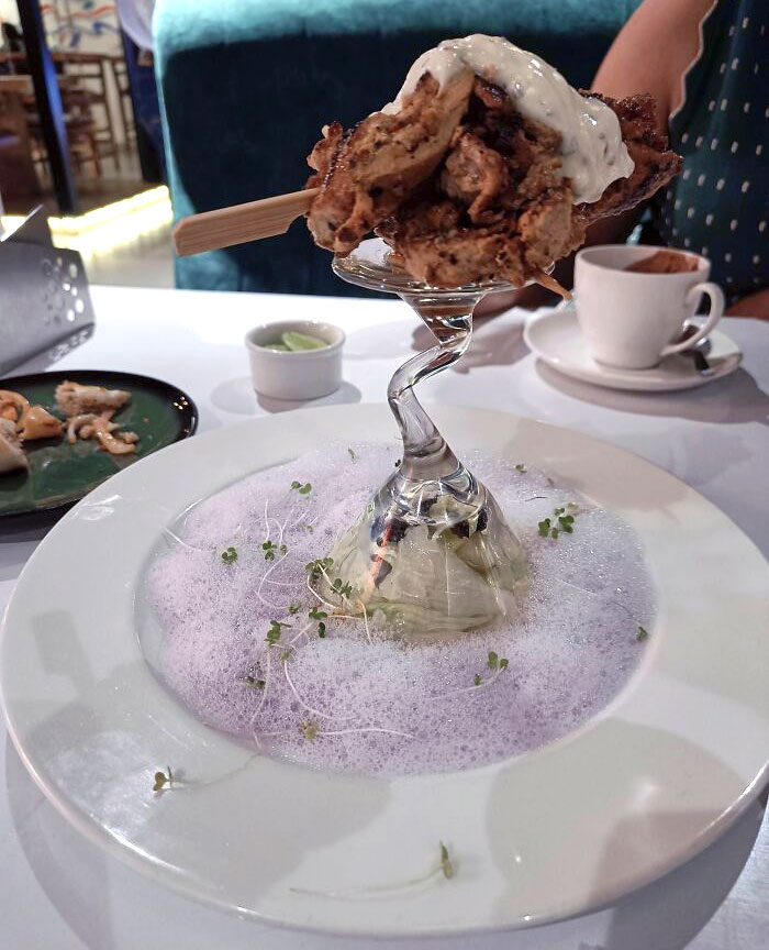 Skewered Chicken Served On Top Of The Bottom Of A Glass