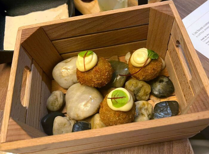 Croquette In A Box Among Rocks