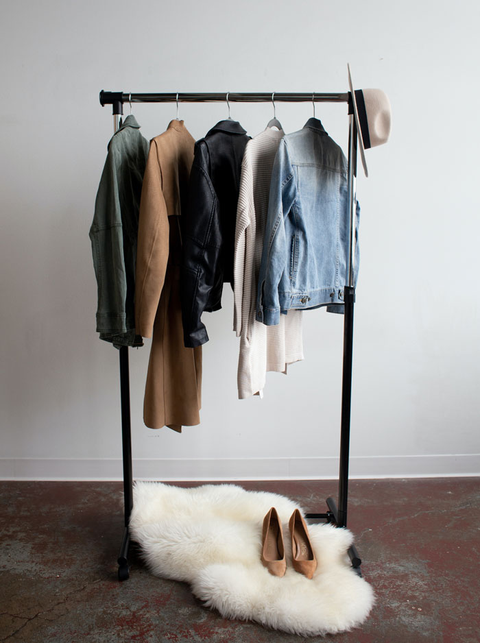 Different colors clothes hanging on hangers