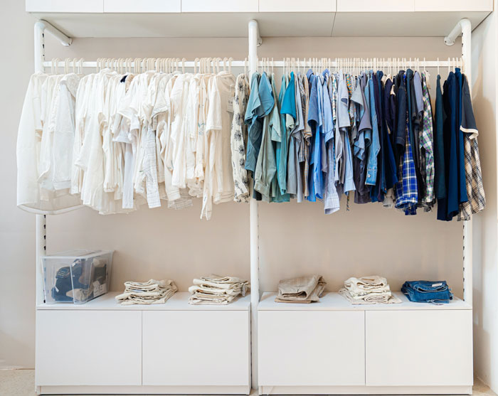 Different clothes hanging on hangers