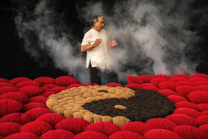 Person near Yin and Yang shape flowers