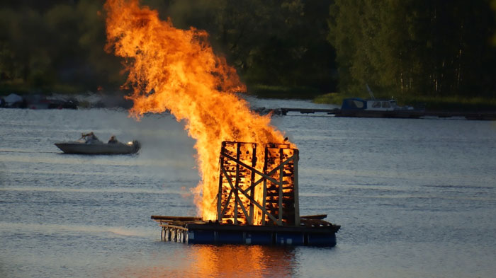 Lighted bonfire at the lake