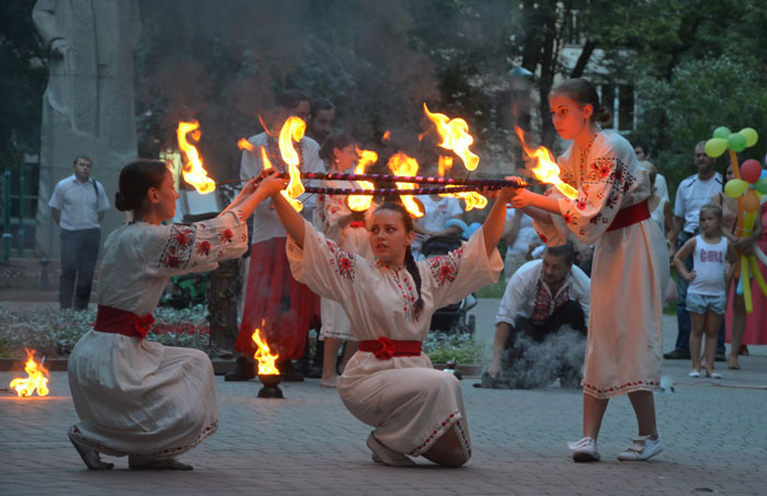 Persons wearing traditional clothes and celebrating Ivan Kupala day