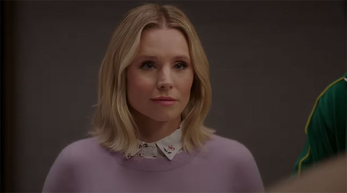 Eleanor wearing purple sweater 