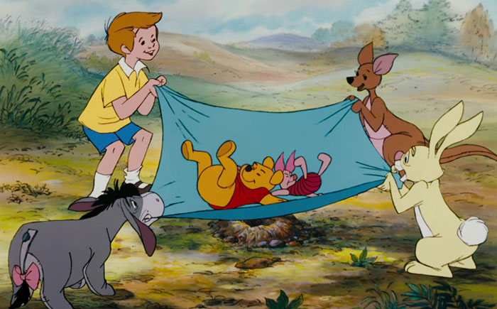 Characters from Winnie the Pooh holding sheets
