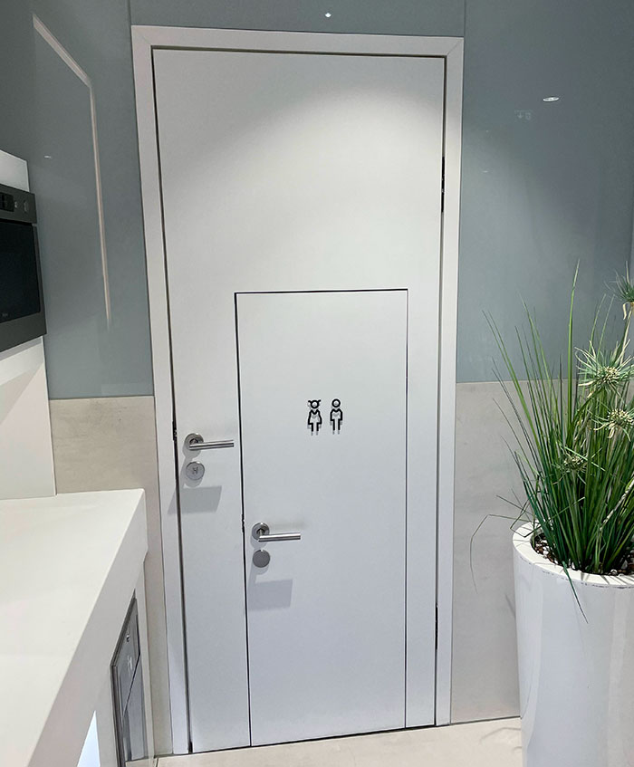 This Bathroom Has A Small Door For The Kids Built Into A Regular Door