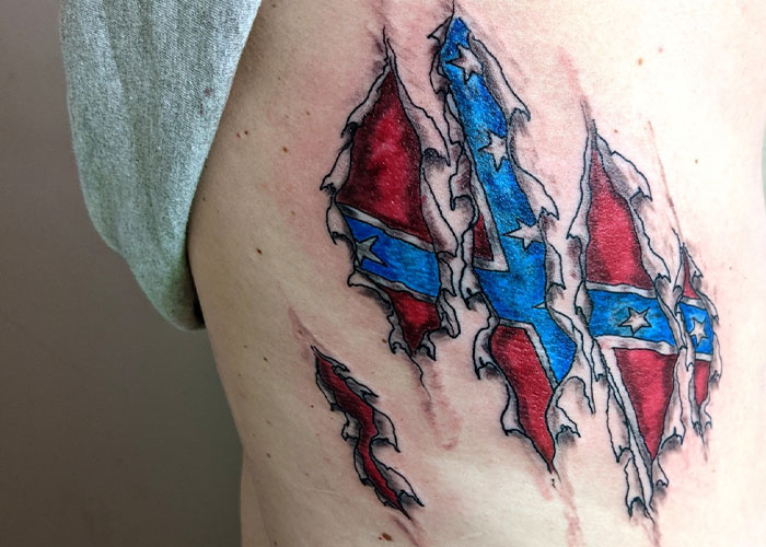 Tattoo design featuring torn Confederate flag, representing commonly criticized and uncreative tattoo art.