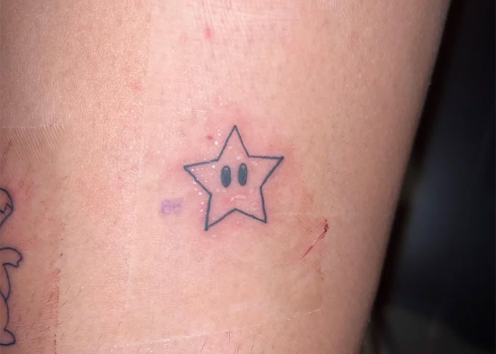 Star tattoo outlined on skin, perceived as lacking creativity.