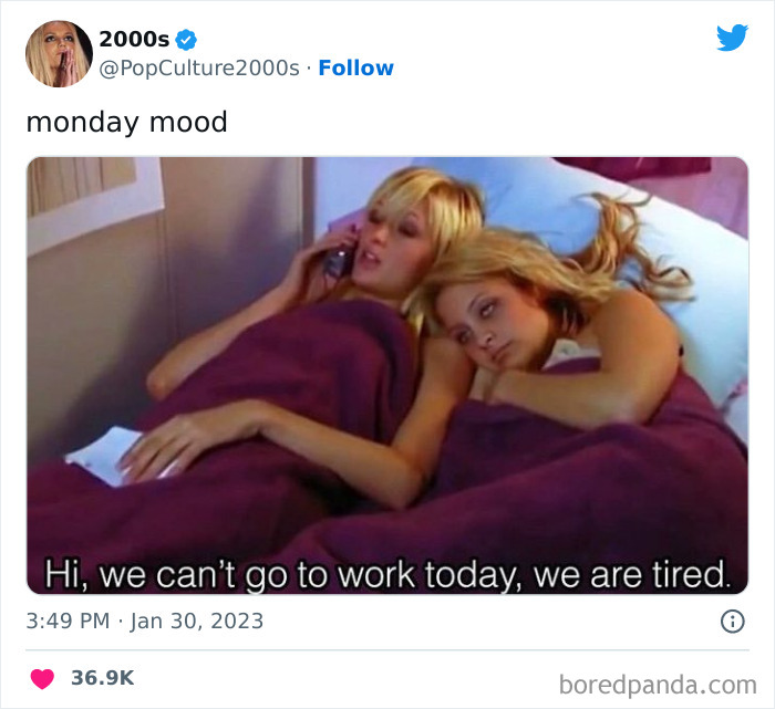 Two women lying in bed, one on the phone with a funny caption about skipping work, reflecting Monday memes mood.