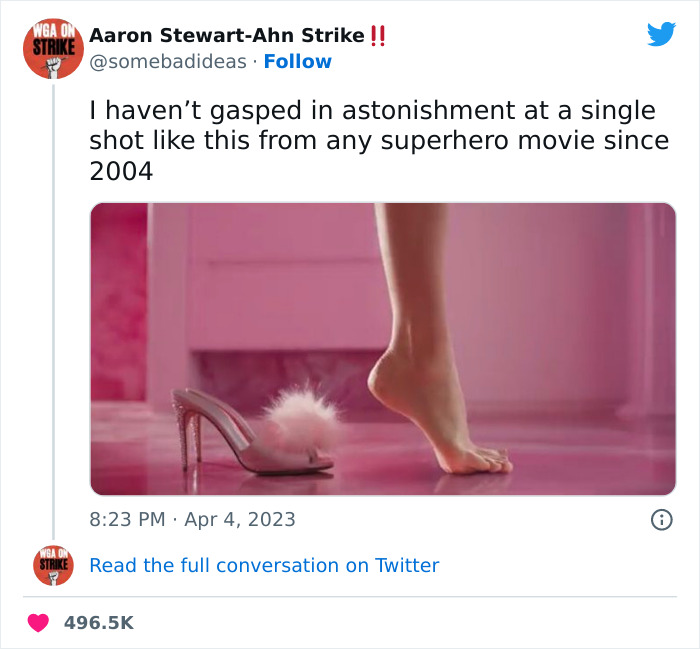 Barbie movie meme featuring a dramatic shot of a foot stepping out of a pink fluffy high heel, capturing fans' attention.