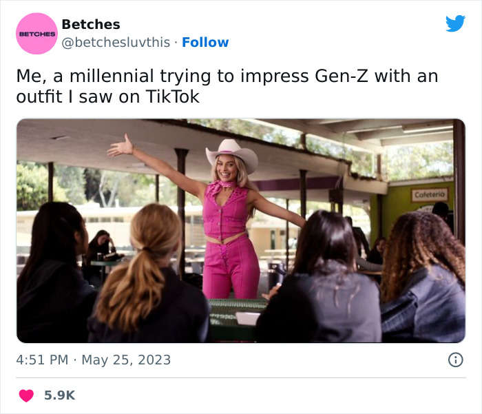 Person dressed as Barbie in pink outfit and cowboy hat, posing in a cafeteria, referencing a popular meme.