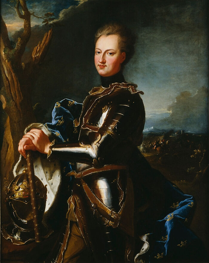 Portrait of a man in armor holding a helmet, illustrating weird and interesting facts shared in an online thread.