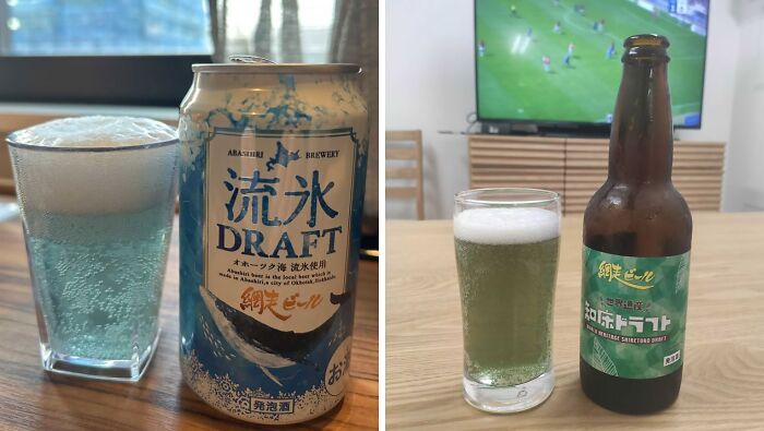 a bottle of bevarages and a glass of liquids