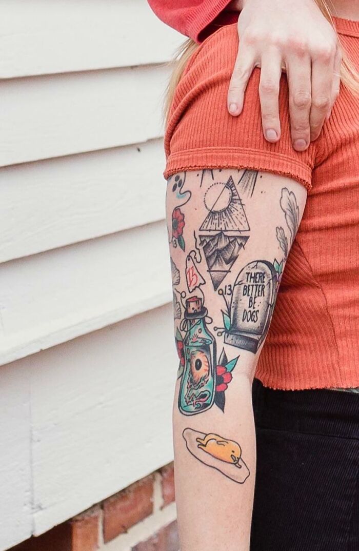 Colorful patchwork tattoo design with geometric shapes on a person's arm, showcasing modern tattoo art creativity.
