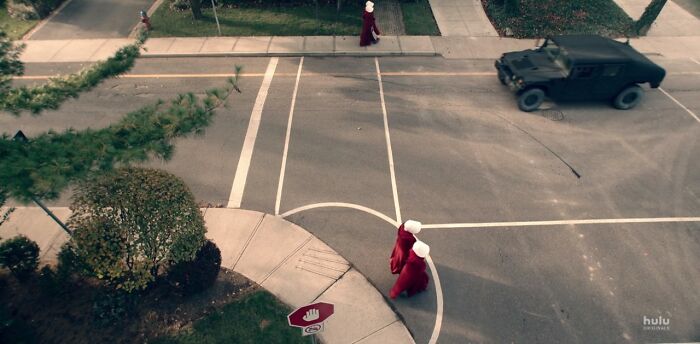 In The Handmaid's Tale, The Stop Signs Have A Hand Signal Instead Of The Word "Stop" Because The Women Are Not Permitted To Read