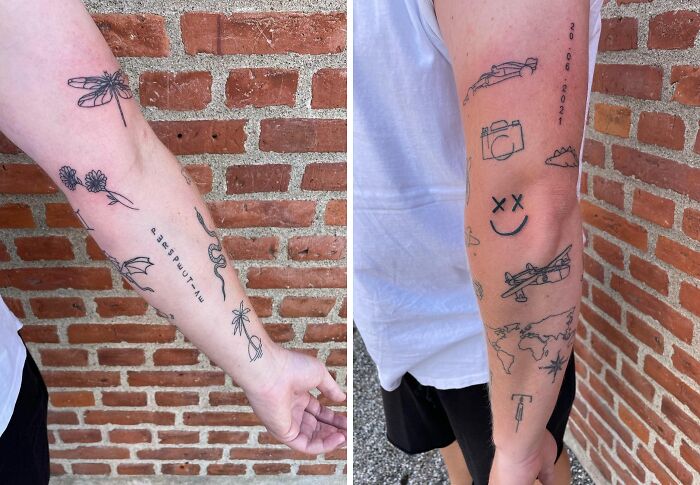 Arms with creative patchwork tattoos including flowers, snakes, and airplanes in front of a brick wall.