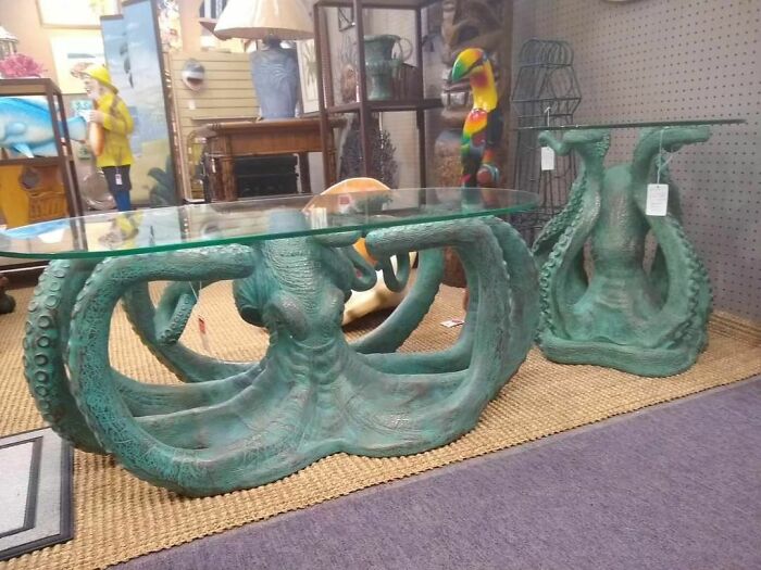 Coffee tables made from octopus statues and glass
