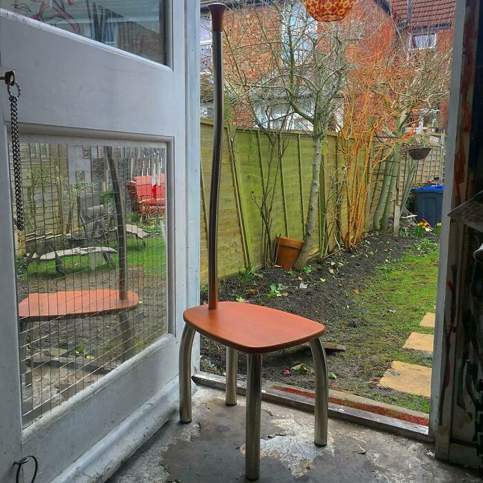 Chair with long back handle