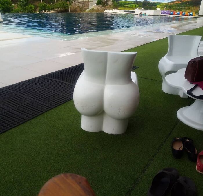 B**t shaped chairs near the pool