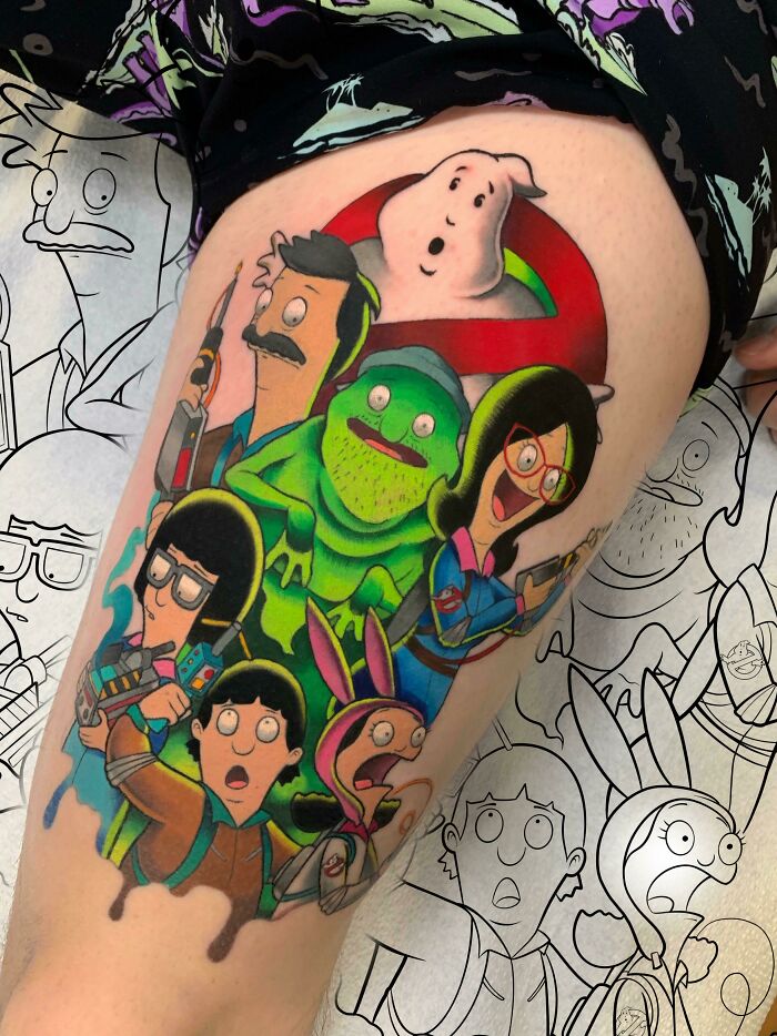 Colorful pop culture tattoo featuring animated characters on a leg.