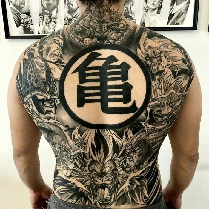 Detailed pop culture tattoo featuring various characters on a man's back.