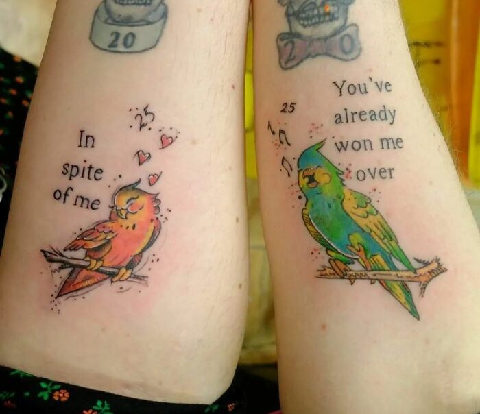 Matching tattoos of colorful birds with loving quotes for special people in your life.