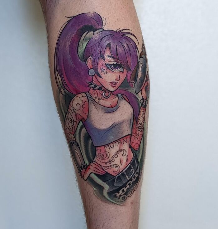 Tattoo of a colorful, animated character with purple hair and tattoos, embodying pop culture art styles.