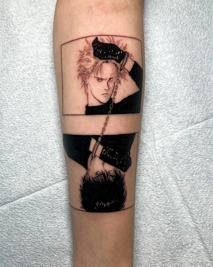 Pop culture tattoo depicting an edgy character in black gloves and clothing, inked on a forearm.