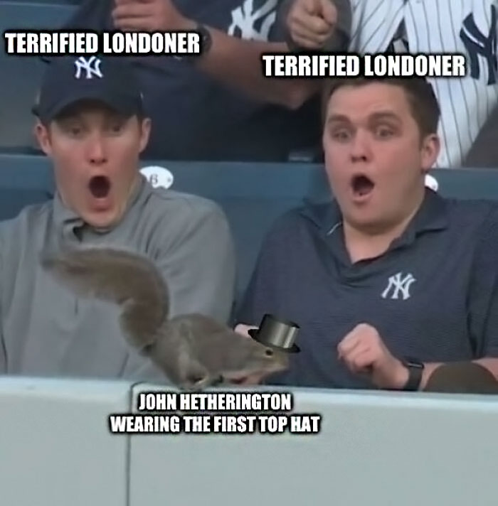 Two surprised men at a sports game reacting to a squirrel edited with a top hat, a popular history meme.