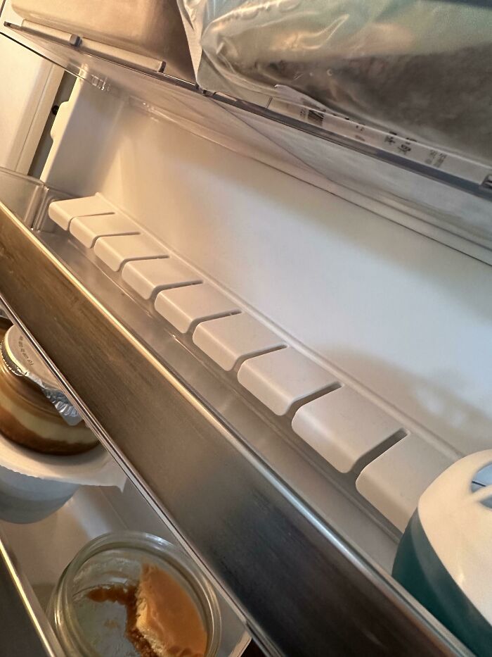 What Is The Function Of This Row Of Flexible Plastic Tabs On My Fridge Door? It’s Not Removable