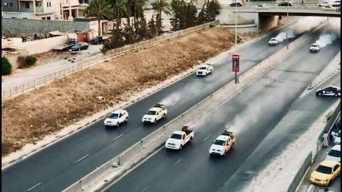 Municipal Pickup Trucks Blowing Gas Through The Streets