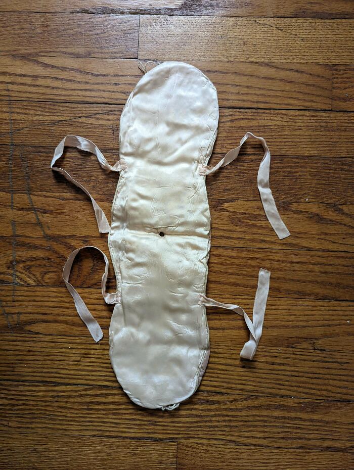 What Is This Padded Satin Item With Ribbon Ties And A Hole In The Middle? Appears Possibly Handmade, Like A Case For A Beauty Item