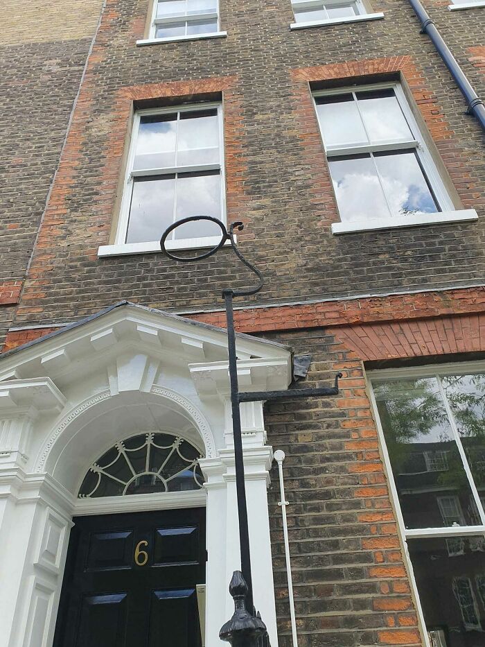 I Spotted A Few Of These Wrought Iron Poles On A Road In Central London, They Must Have Had Some Historical Usage, But I'm Not Sure What. Perhaps For Lamps? Did The Circle At The Top Used To Hold Something? Was The Arm On The Right For Hanging Something?