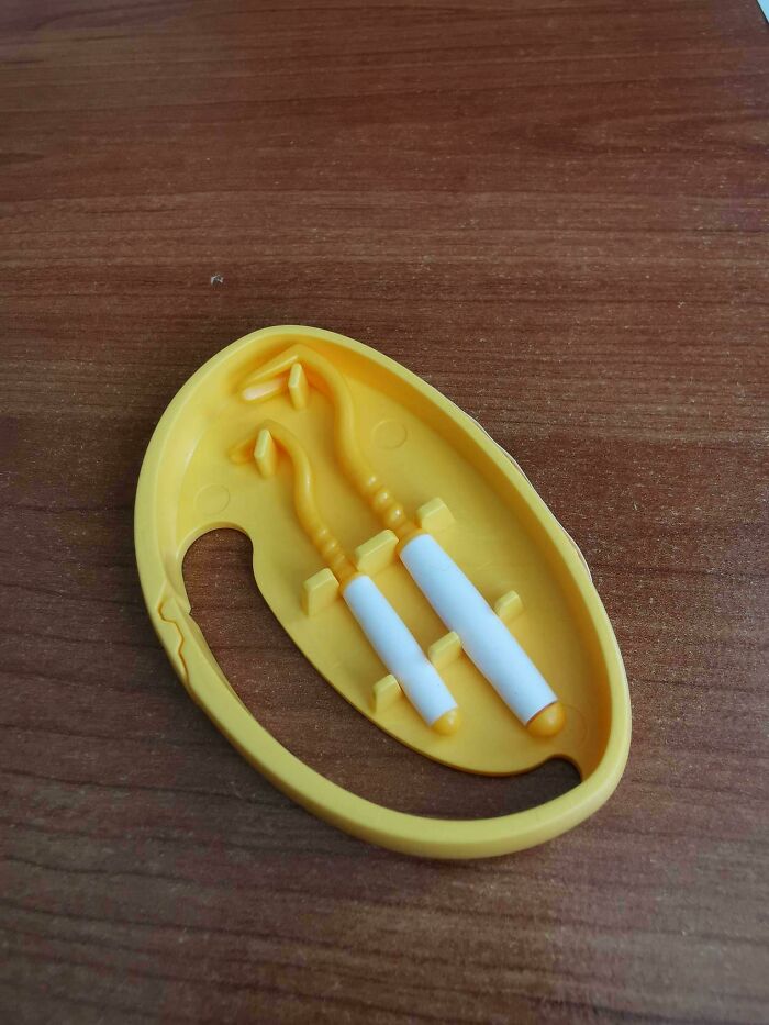 Two Plastic Hook Shaped Tools With Double Forks On The End. What Are These And What They Used For?