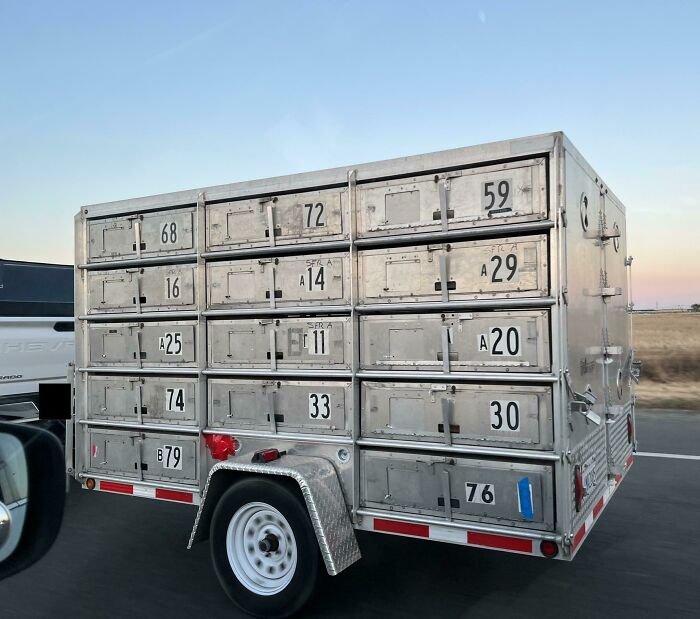 Small Trailer With Individual Openings. Seen While Driving, No Obvious Marking That Would Indicate What It’s For