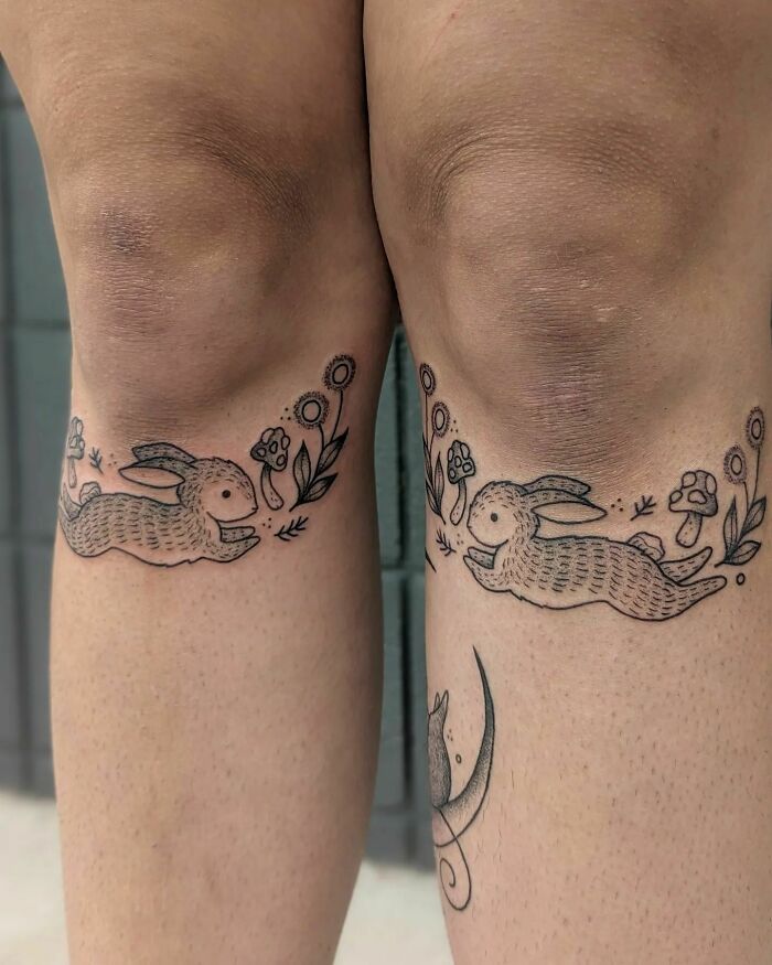Knee tattoos featuring rabbits and flowers in a whimsical design.