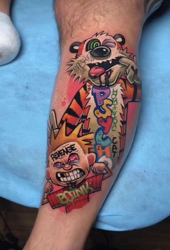 Colorful ‘90s tattoo of cartoon characters on a calf, featuring bold designs and vibrant colors.
