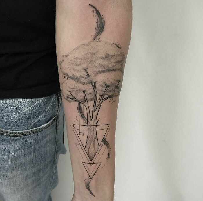 Tree tattoo on forearm with geometric shapes, symbolizing the wonders of nature.