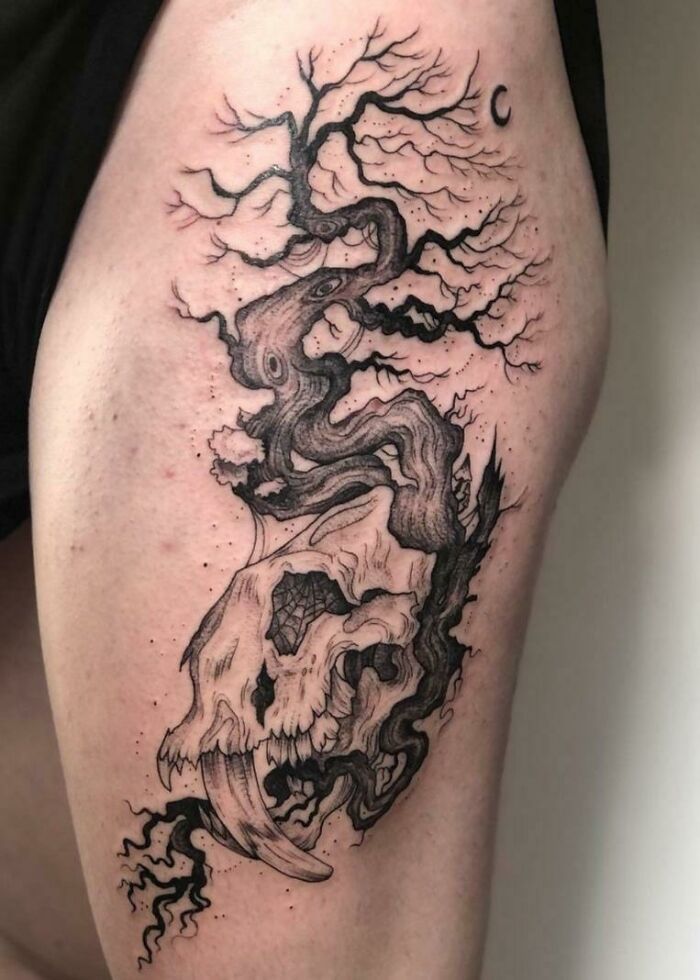 Majestic tree tattoo with a skull design blending nature and art on skin.
