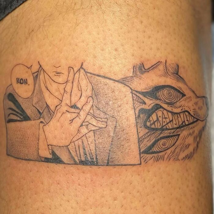 Anime tattoo depicting a panel featuring a character and a grinning monster, detailed line art style.