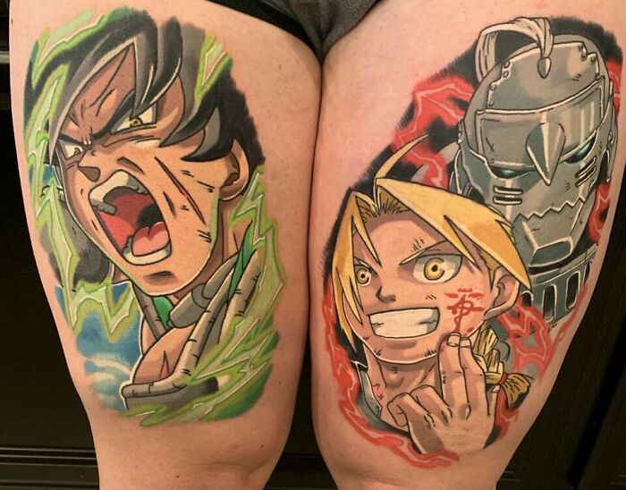 Anime tattoos featuring vibrant characters on thighs, expressing intense emotions and dynamic styles.
