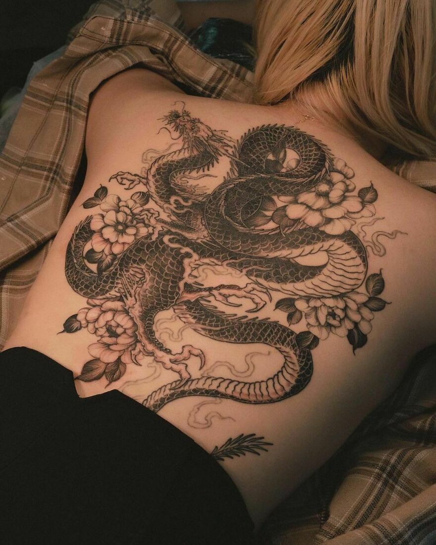 Back tattoo of an intricately designed dragon.