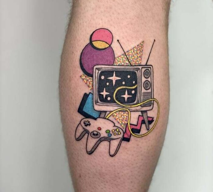 '90s tattoo featuring a retro TV and video game controller, highlighting nostalgic pop culture elements.