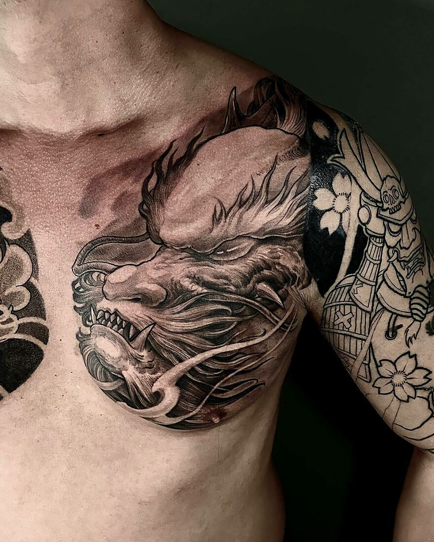 Dragon tattoo design on chest showcasing intricate details and fierce expression.