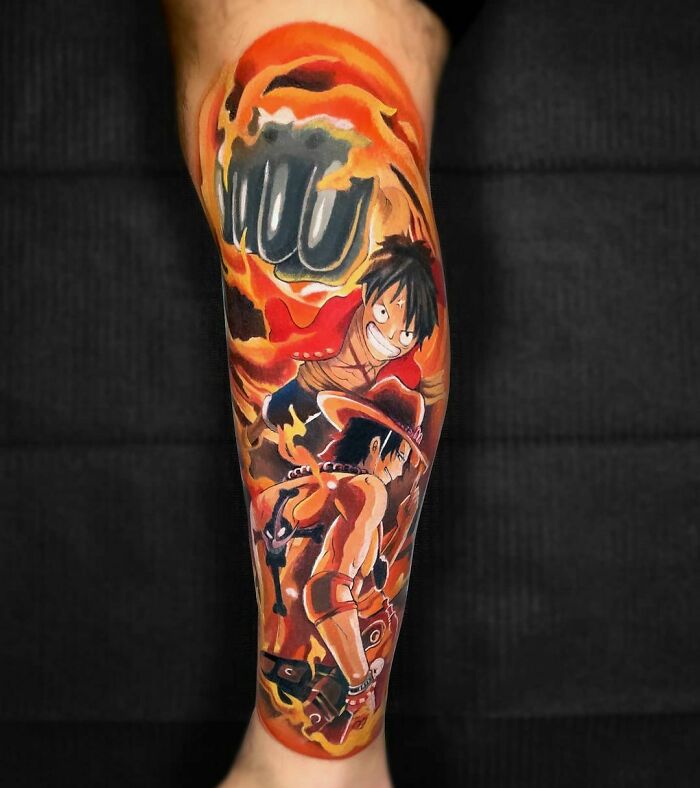 Anime tattoo featuring fiery characters in dynamic action, highlighting bold colors and intricate design.