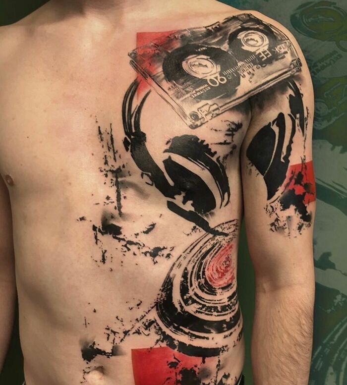 Trash Polka tattoo design featuring cassette tape and abstract patterns on a person's chest.