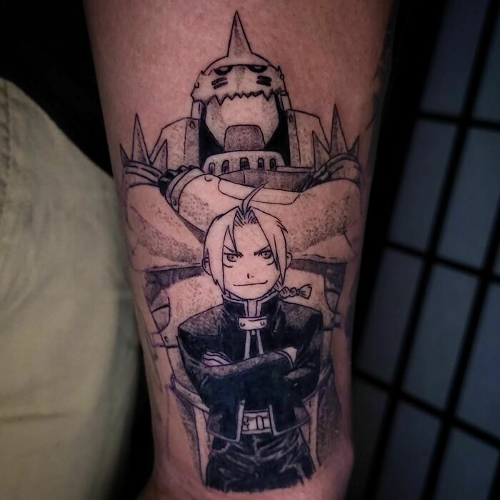 Anime tattoo featuring two characters, one with armor and another with a braid, showcasing detailed artwork on a person's arm.